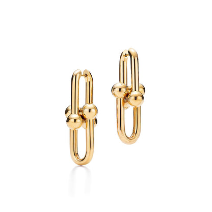 Gold hoop earrings on a white background